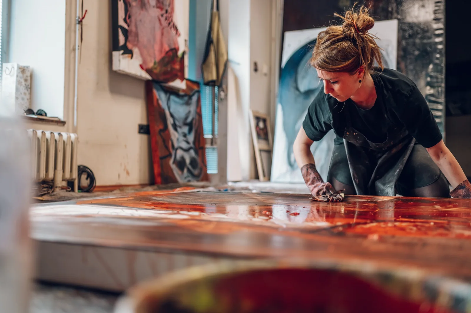 A creative at work in a printmaking studio